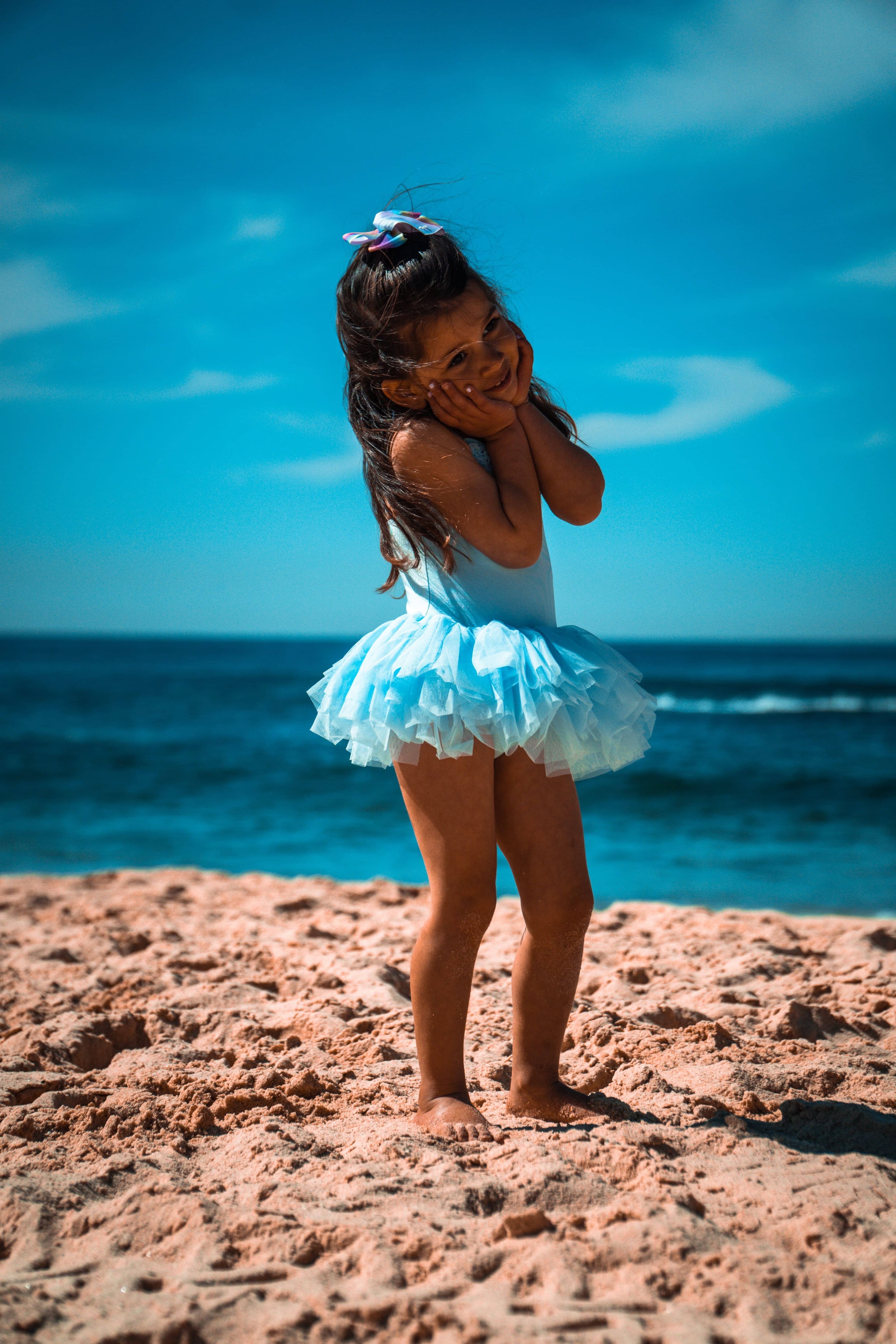 Ballet student in tutu at the beach